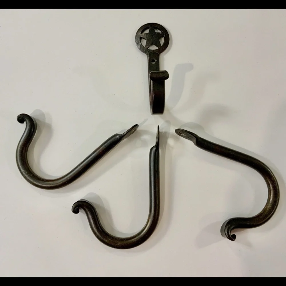 FOUR hand forged‎ iron hooks.